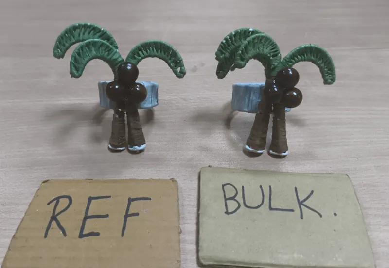 Two handmade palm-tree napkin rings with woven leaves, above REF and BULK cards.